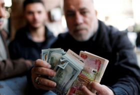 صندوق النقد الدولي يرحب موافقة على خفض قيمة الدينار العراقي